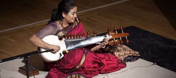 A photo taken from the balcony of Debasmita playing the sarod on stage at St George's.