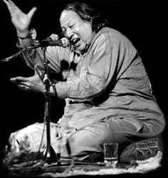 The King of Qawwali, Nusrat Fateh Ali Khan performing live on stage.