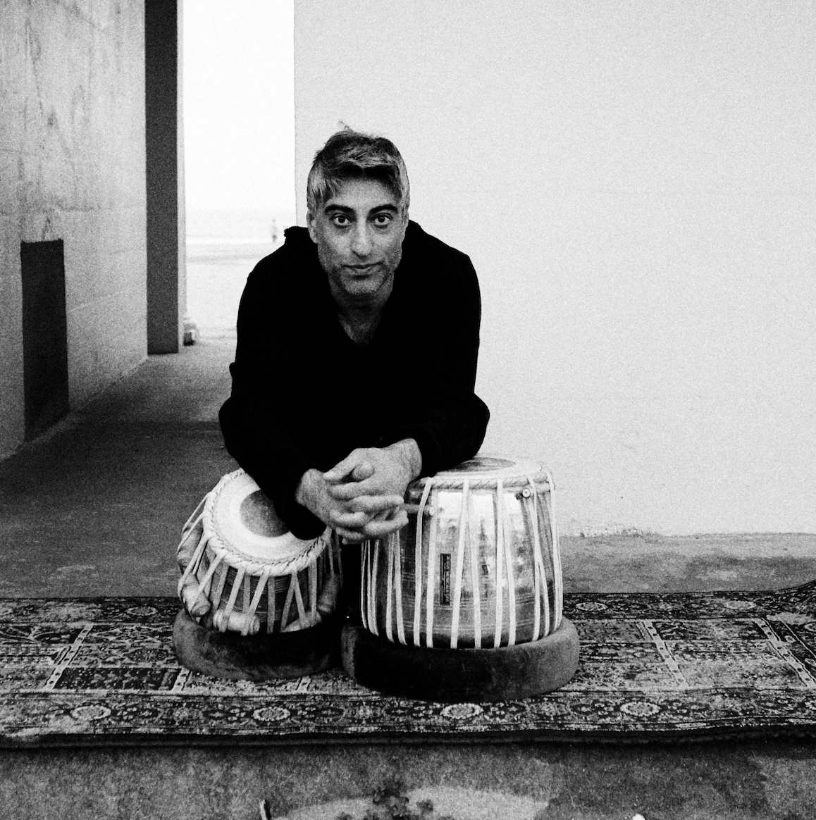 Dalbir Singh Rattan seated behind his tabla